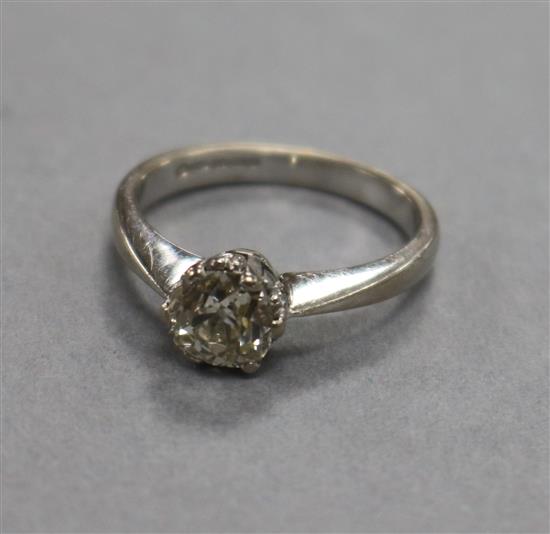 An 18ct white gold and solitaire diamond ring, size L.